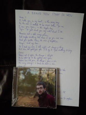 Signed copy of Mere Words and Melodies with handwritten lyrics